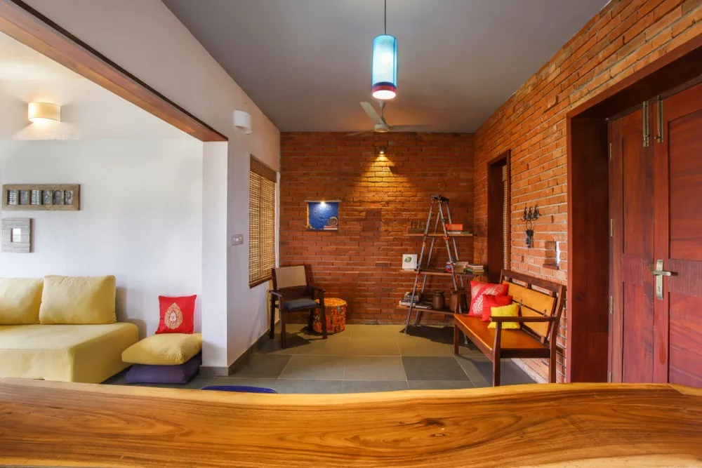 GoodEarth Calicut interior design — natural wood finishes and climate-responsive sustainable home interiors in Kozhikode